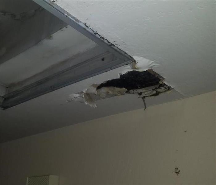 Hole in the ceiling from a water leak