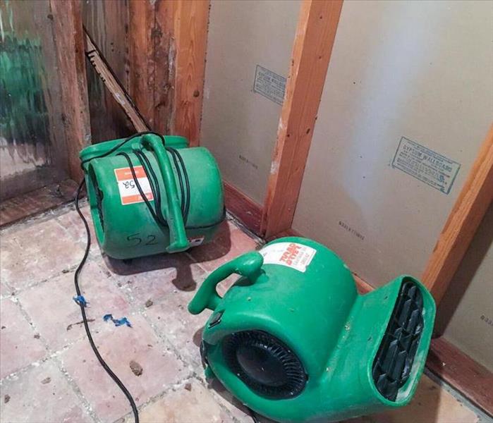Green air movers on floor.